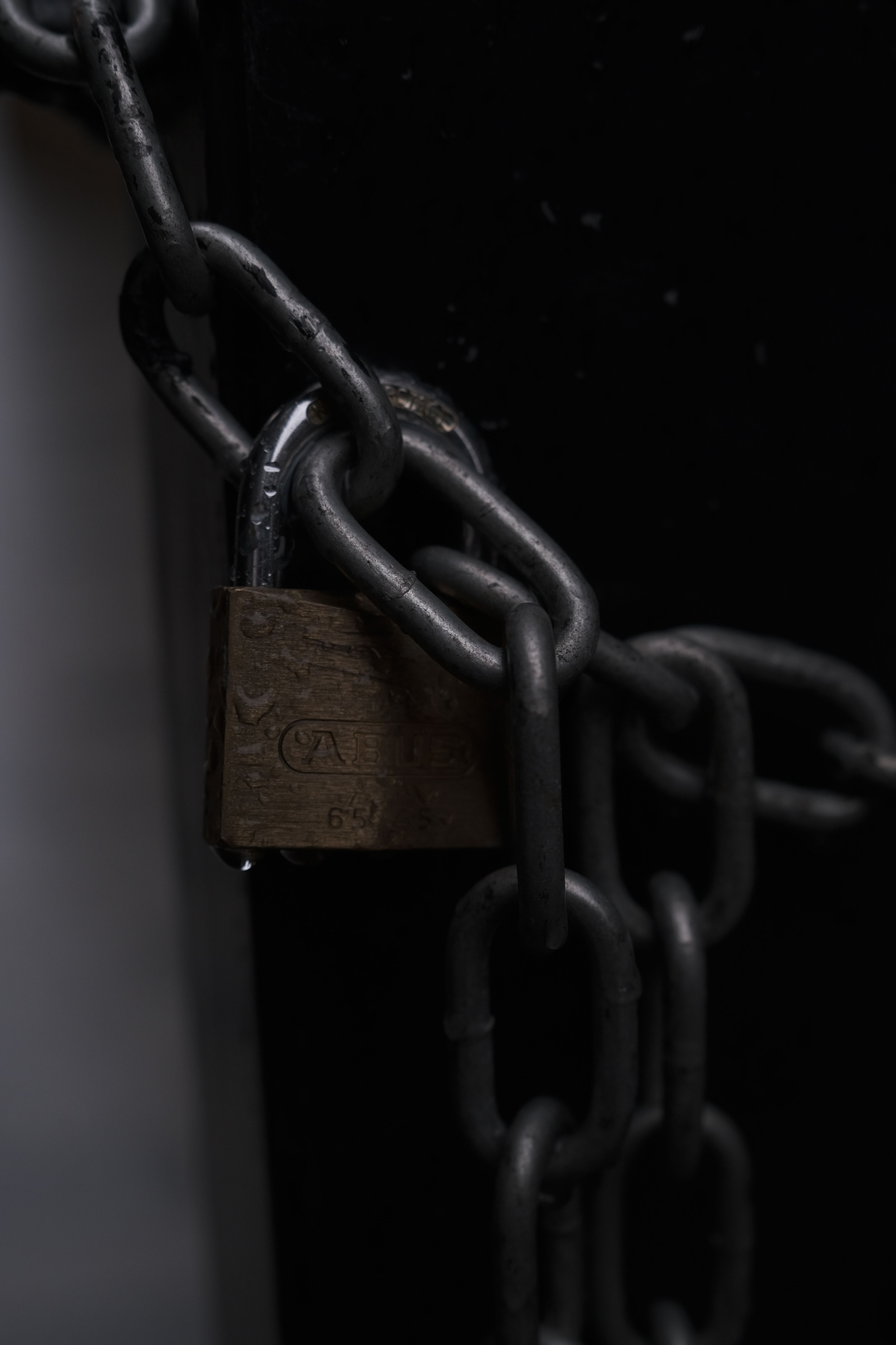 Secure metal chain with padlock depicts safety and security.