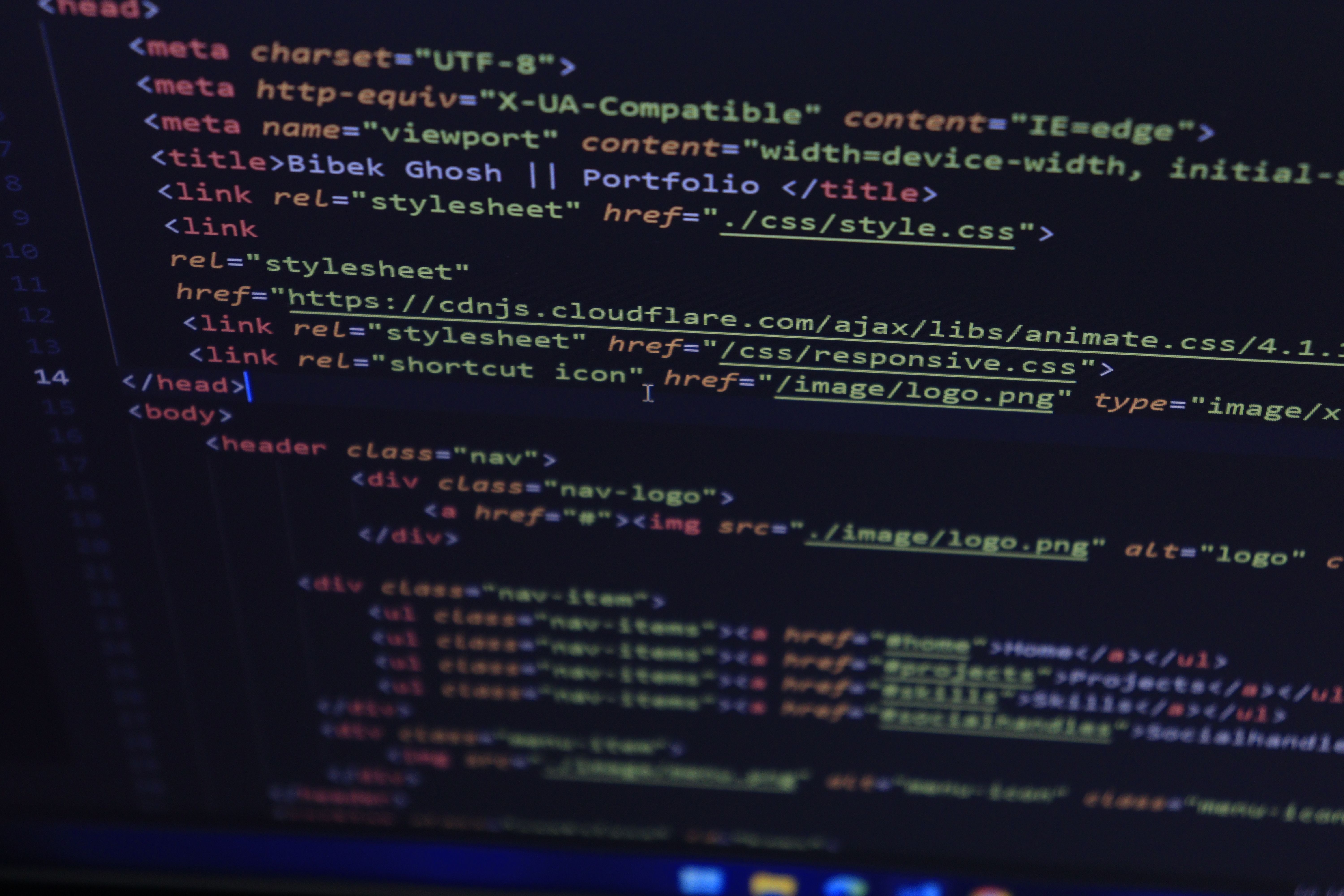 Close-up of HTML and CSS code displayed on a computer screen, ideal for tech and programming themes.