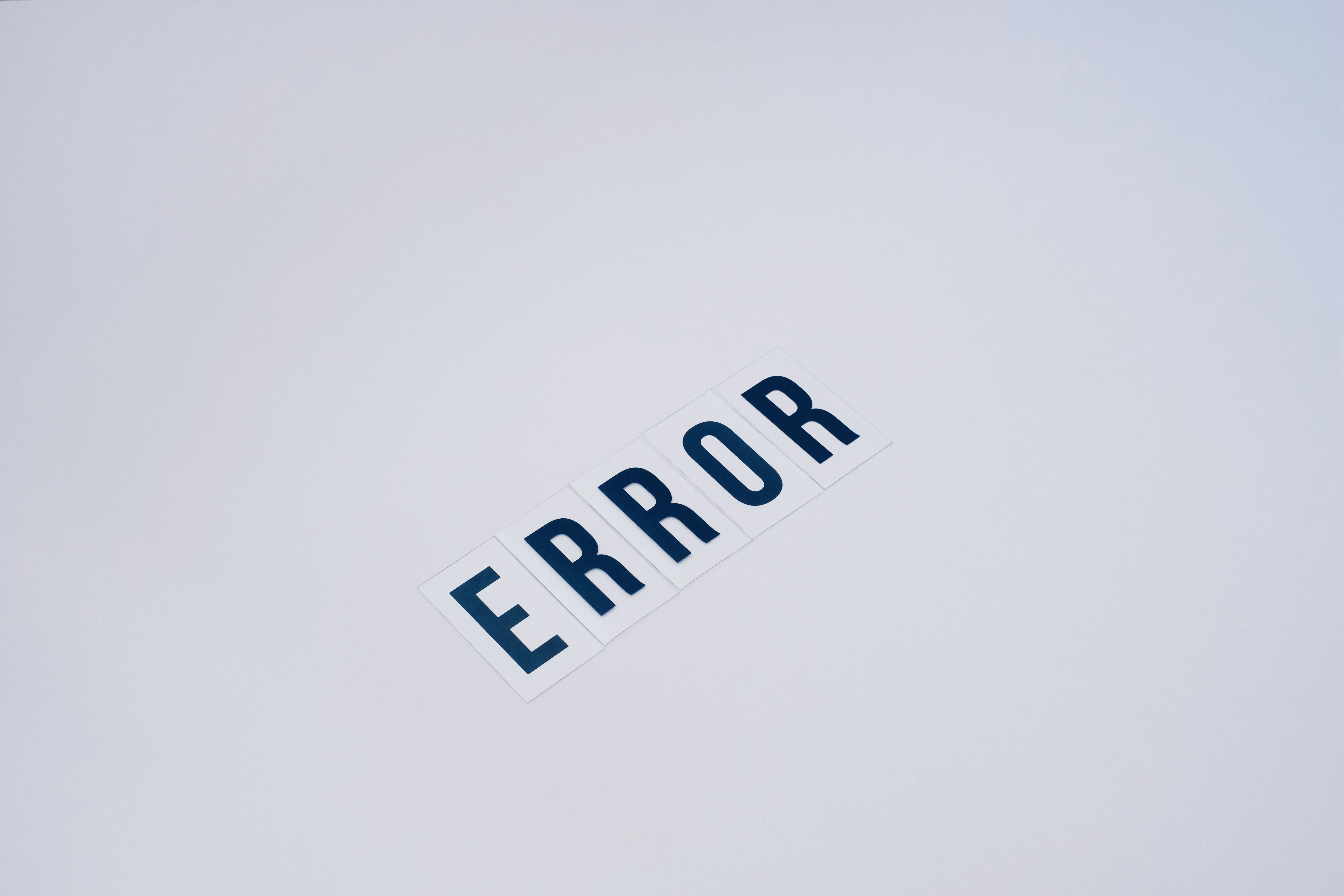 Simple and minimalist image showcasing the word 'ERROR' on a white background.